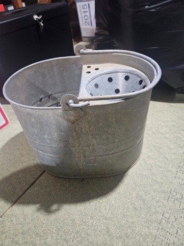 Old used galvanised metal mop